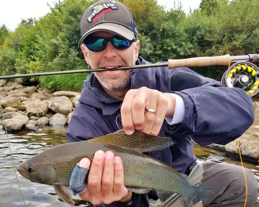 The author's friend Gary with a big Grayling caught on the Little Ku River,  Alaska