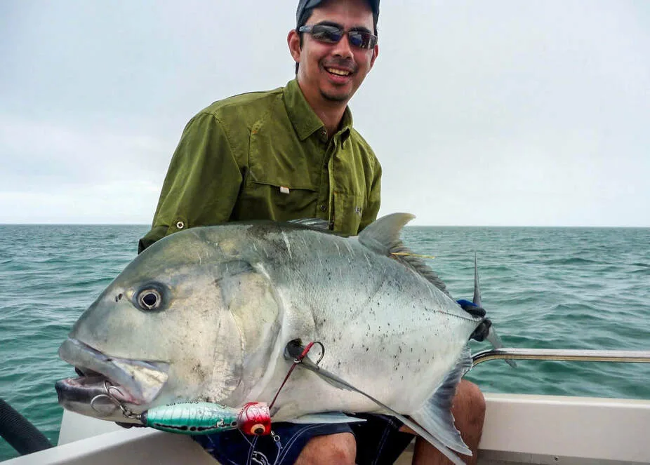 The author with a Giant Trevally caught in Nekweta, New Caledonia