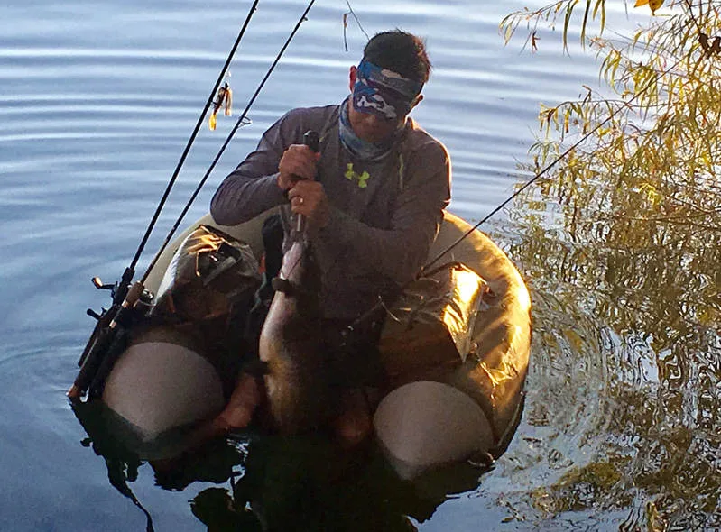 Not the best picture, but here is www.howtocatchanyfish.com author Dan Smith with a 13lber caught from a float tube using a tiny plastic jig and 4lb test while fishing for panfish.  Channel Catfish are sometimes caught on lures meant for other fish, although they are primarily targeted with bait.