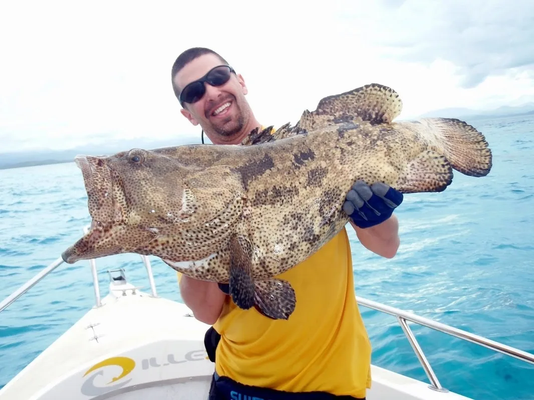 The author's friend Gary with a Flowery Cod caught on a stickbait in New Caledonia
