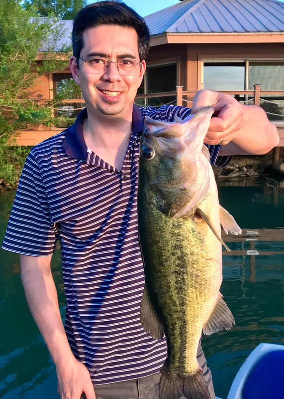 A healthy bass caught in Texas on a plastic crawdad after work