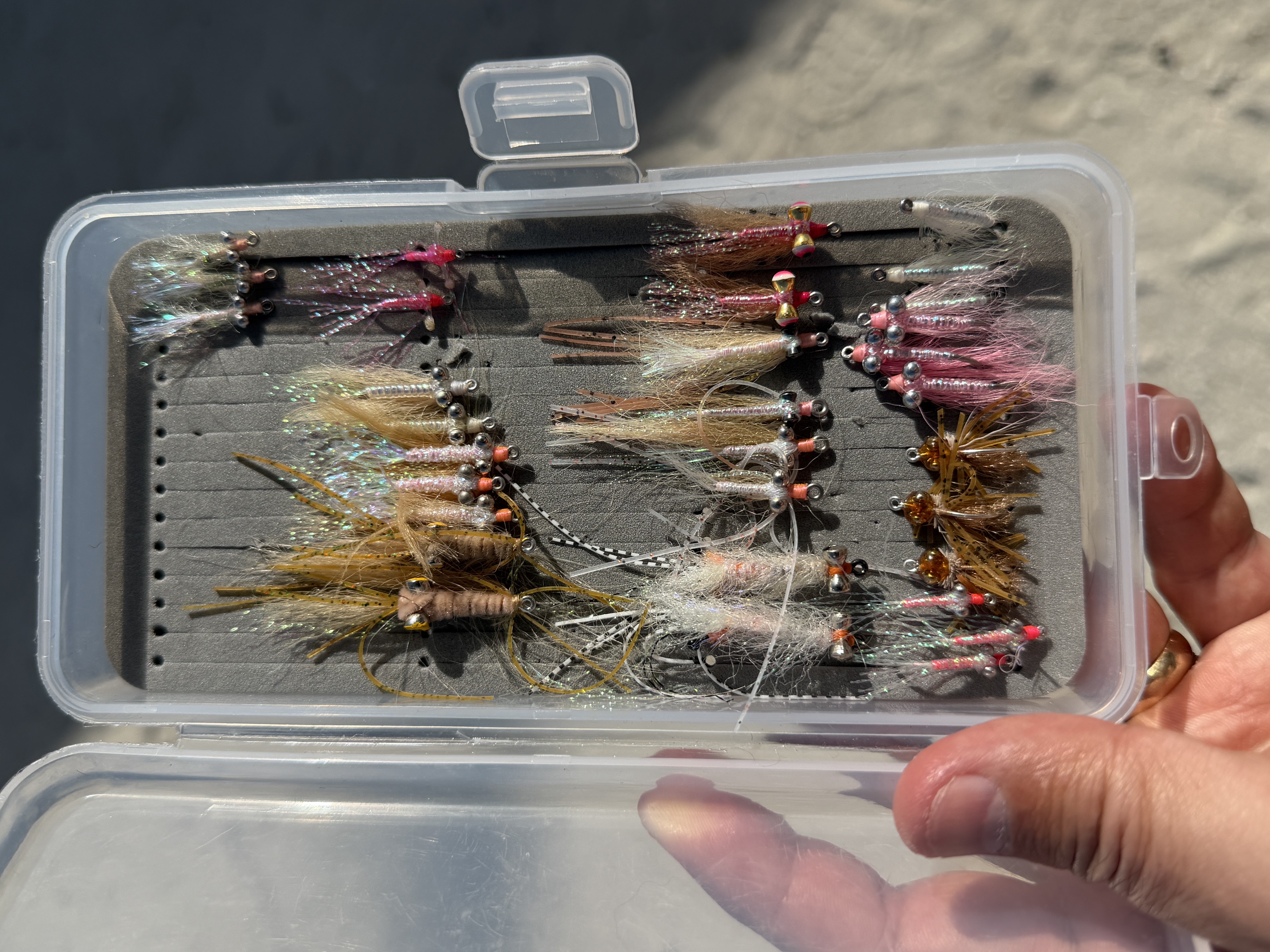 A box of Bonefish flies. Crazy Charlies, Gotchas, and Christmas Island Specials are popular in White, Tan, Pink, and Orange