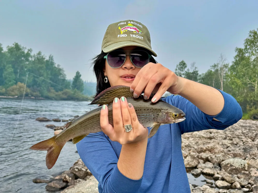 The author's daughter with a nice Grayling caught in Egenolf Lake, Canada