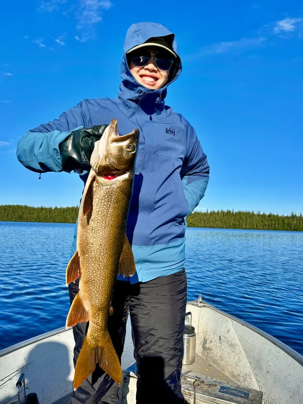 The author's daughter with a nice fish taken in Booth Lake, Canada