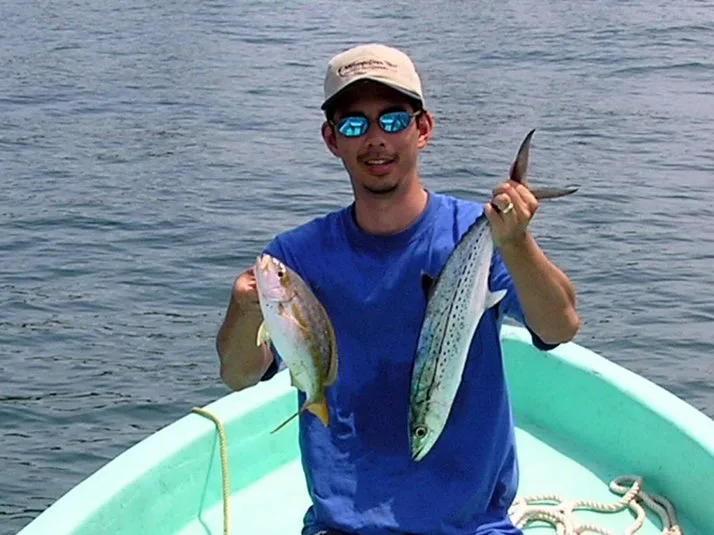 A Yellowtail Snapper and Cero Mackerel caught right on the reef with live sardines in Belize.